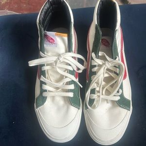 Cream vans with forest green red and yellow trim